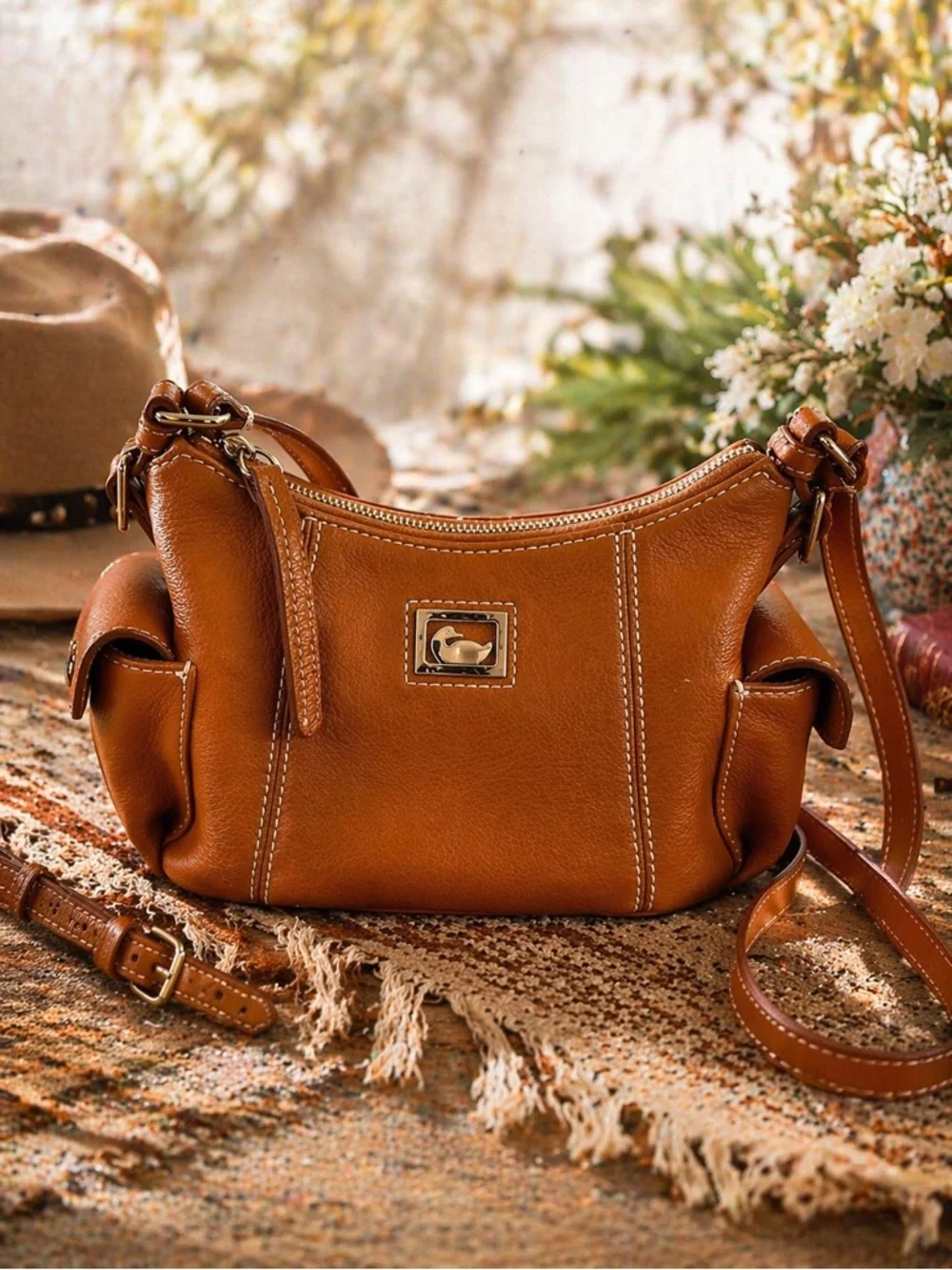 Dooney & Bourke Pebbled Grain Pocket Sac Crossbody with Side Pockets.